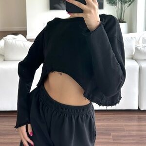 DylanLex archived black cropped sweatshirt with distressed hem.